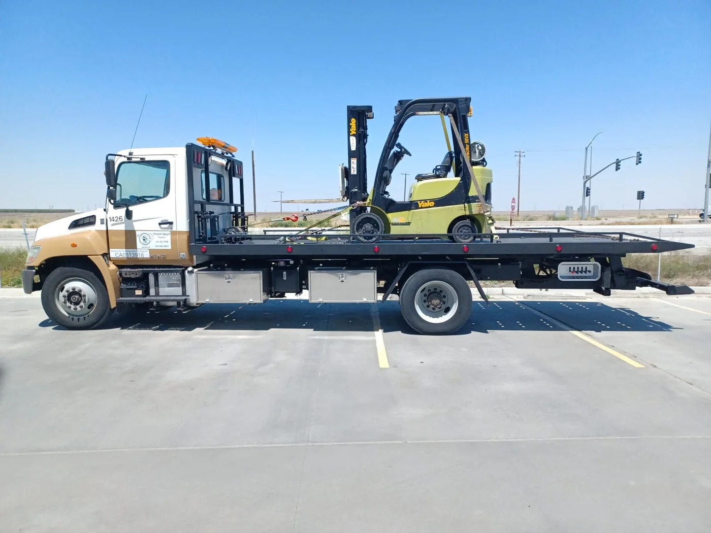 Flatbed carrier truck, three-quarter view